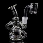Clear glass dab rig with intricate looping design and quartz banger.
