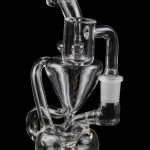 Clear glass water pipe (rig) with intricate looping design, isolated on black.