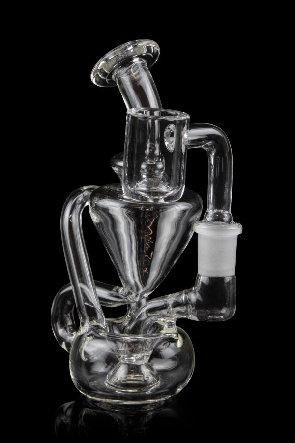 Clear glass water pipe (rig) with intricate looping design, isolated on black.