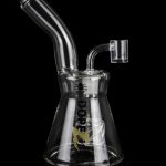 Glass water pipe (bong) with intricate design and clear glass, isolated on a black background.