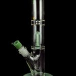 Green glass water pipe (bong) with percolators, isolated on black.