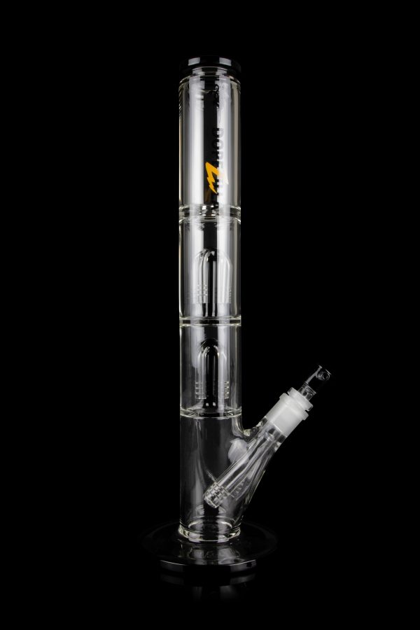 Clear glass bong with multiple chambers and a detachable downstem, isolated on a black background.