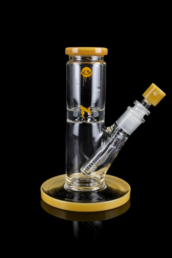 Clear glass water pipe (bong) with gold accents and a cannabis-themed decal, isolated on a black background.