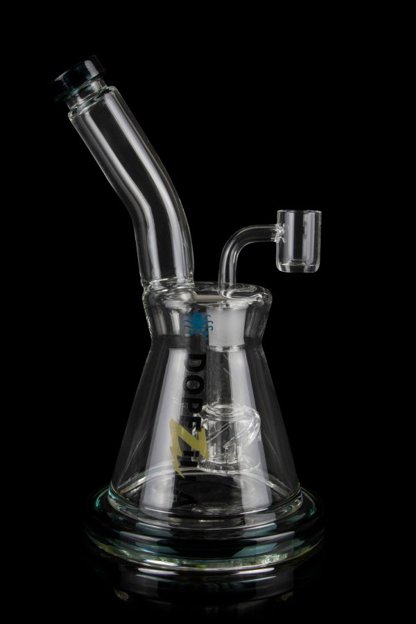 Clear glass water pipe (bong) with intricate percolator and accompanying glass bowl, isolated on a black background.