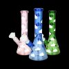 Three glass bongs with cloud patterns in pink, blue, and green against a black background.