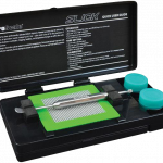 The Pro Scale Slick Concentrate Kit & Scale is displayed open, revealing a close-up of its components and instructions within the black case.