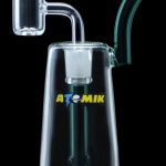 Glass dab rig with quartz banger and colorful accents.