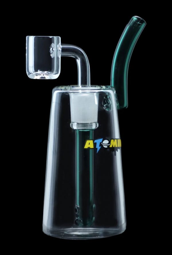 Clear glass dab rig with a quartz banger and colorful accents, branded “ATOMI”.
