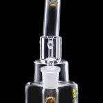 Clear glass bubbler water pipe with amber accents, isolated on a black background.