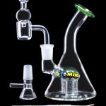 Glass rig with attachments for dabbing cannabis concentrates.