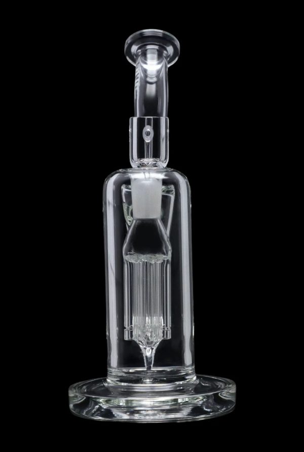 Clear glass dab rig with intricate percolator design, isolated on a black background.