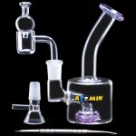 A side view of the Atomik Little Dipper Dab Rig, showcasing its clear glass construction and compact 5.25-inch size.