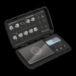 Digital scale with open case displaying quick start guide, likely for measuring cannabis.