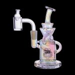 Iridescent glass dab rig with a quartz banger, featuring a “Stash Shack” logo.