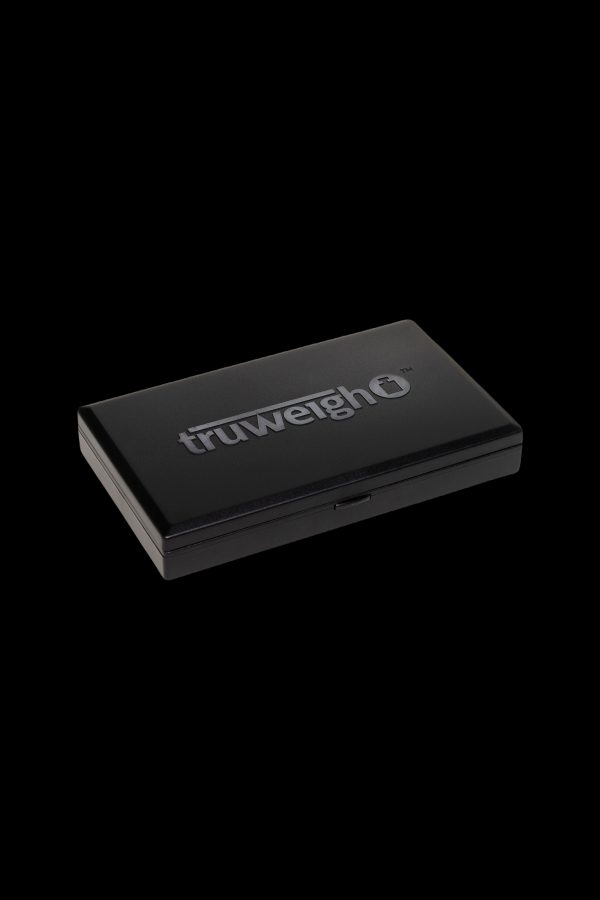 Black TruweighO digital scale for cannabis, displayed on a dark background.