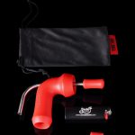 Red nectar collector with titanium tip, glass dish, and storage bag against a black background.