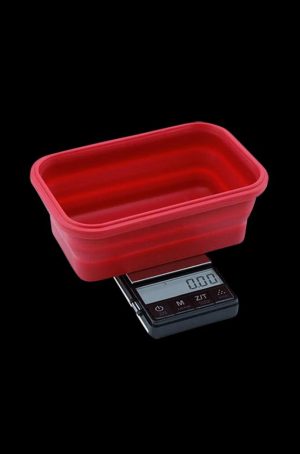 A close-up shows the Truweigh Crimson Collapsible Bowl Scale with a digital readout, angled against a dark backdrop.