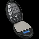 A close-up, angled view of the Truweigh Sonic Digital Mini Scale, displaying its digital readout and calibration instructions.