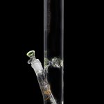 Green glass bong with ice catch and detachable downstem.