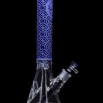 A front view of the 15-inch Cloud Cali Engraved Thick Base Beaker Water Pipe, showcasing its patterned engraving against a dark backdrop.