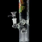 Green glass water pipe (bong) with intricate perc diffusion and patterned design.