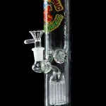 Green glass bong with percolator and branded label against a black background.