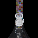 Colorful glass water pipe (bong) with geometric patterns.