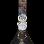 Clear glass bong with colorful geometric patterns, studio shot on black background.