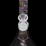 Glass bong with colorful geometric patterns and percolators, isolated on a black background.