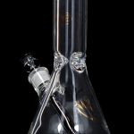 Clear glass bong with ice catch and downstem against a black background.