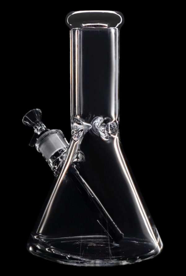 Clear glass bong with a flared base and angled neck, isolated on a black background.