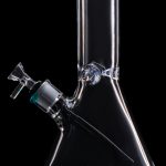 Glass bong with blue accents against a black background.