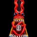 A vibrant red glass bong shaped like a monster with bulging blue eyes, sharp teeth, and colorful tentacles, set against a black background.