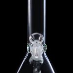 Clear glass bong with green accents, isolated on a black background.