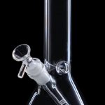 Clear glass bong with a flared base and blue accent on the mouthpiece.