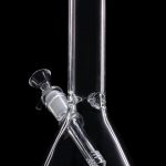 Clear glass bong against a black background.
