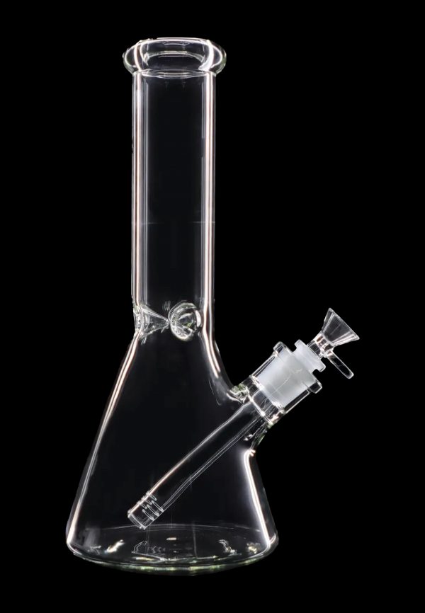 Clear glass bong with a flared base and downstem against a black background.