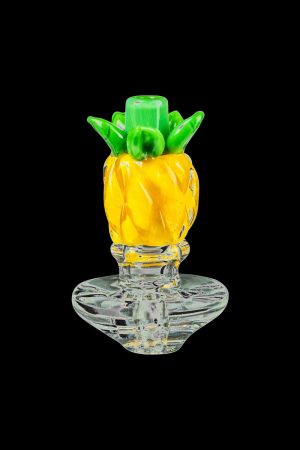 A close-up, angled view of the Pineapple Carb Cap for Puffco Peak, showcasing its textured, translucent glass design.