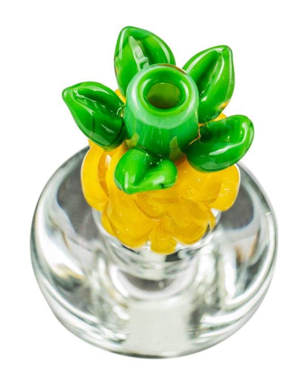 A close-up, angled view of the Pineapple Carb Cap for Puffco Peak, showcasing its translucent, colorful design.