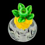 A close-up shot of the Pineapple Carb Cap for Puffco Peak, showing its textured, rounded top against a dark background.