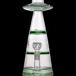 A clear glass water pipe shaped like a UFO with green accents.