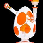 Orange and white glass water pipe with a mushroom shape.