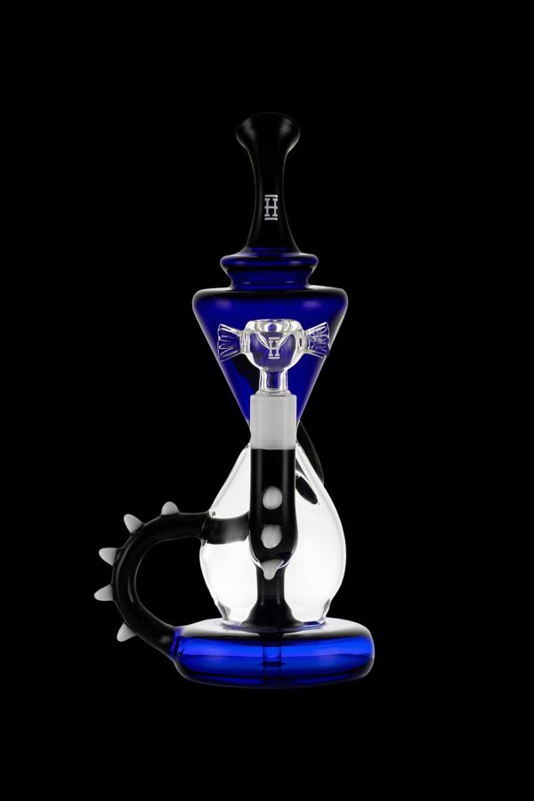 Blue and black glass water pipe (rig) with intricate design and curved mouthpiece, isolated on a black background.