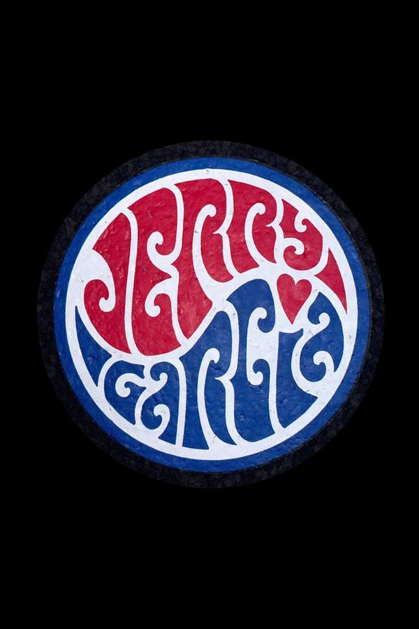 Circular sticker featuring stylized lettering of "Jerry Garcia" in red and blue with heart and swirl motifs, isolated on a black background.