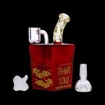 Red glass bubbler shaped like a Chinese takeout container with ornate gold designs, alongside a white glass mushroom and bubbler, on a black background.