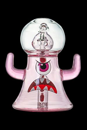 Pink glass water pipe shaped like a cartoon monster with a large eye and mushroom-shaped mouthpiece.