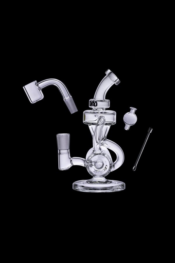 Clear glass dab rig with attachments on a black background.