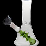 Glass bong with a green, thorn-covered downstem and black mouthpiece, isolated on a black background.