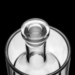 Clear glass bubbler with a removable downstem, isolated on a black background.