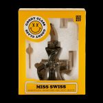 A retail box for "Goody Glass" cannabis accessories, showcasing a brown glass "Miss Swiss" mini rig kit with tools inside.